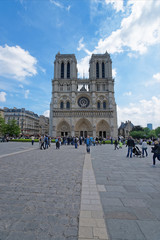 People at Notre Dame de Paris Cathedral in Paris France