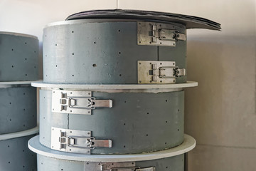 Pile of special forms for Comte Cheese in the dairy