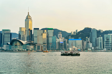 Star ferry at the Victoria Harbor in Hong Kong at sunset