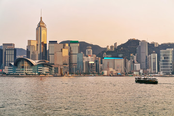 Star ferry at the Victoria Harbor of Hong Kong at sunset