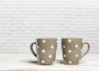 Coffee cups on wooden table