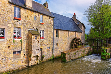 Fototapeta na wymiar Water mill and Aure River of Bayeux in Normandy France