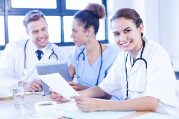 Female doctor meeting with colleagues