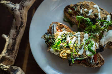 Homemade sourdough toast with capers anchoivies and omelette