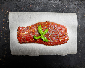 marinated fillet of veal meat on paper for baking.Top view.