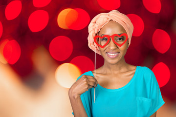 African american woman having fun with photo props