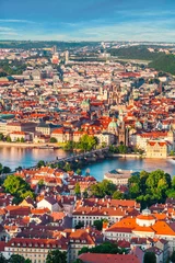 Poster Panorama of the old part of Prague from the Petrin tower. Beautiful view on the bridges over the river Vltava at sunset. Old Town architecture, Czech Republic. © LALSSTOCK