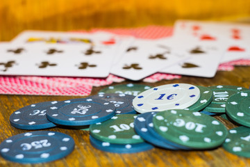 Green, blue chips and cards for poker