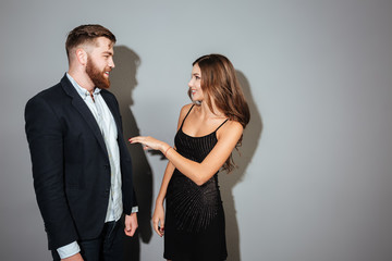 Young attracctive couple in smart wear talking to each other