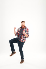Full length portrait of a happy man celebrating his success