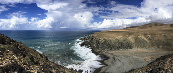 Atlantic steep coast on the Canary Islands with a bay.