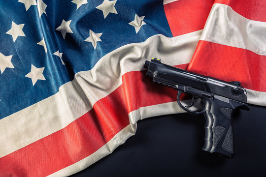 Handgun lying on American flag