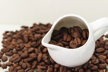 Roasted Coffee Beans / Roasted Coffee Beans In Cup Scattered Isolated On White.