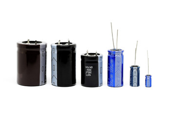 Group of capacitors different sizes isolated on white background.