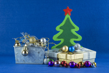 Merry Christmas and Happy New Year concept,Christmas tree with gift box,blue background.