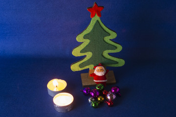 Merry Christmas and Happy New Year concept,Christmas tree with Santa Claus,low key,blue background.