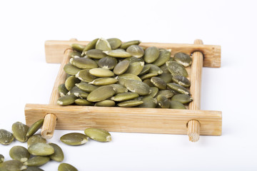 Pumpkin seeds on a white background.