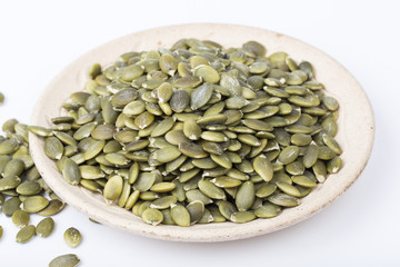 Pumpkin seeds closeup in a plate