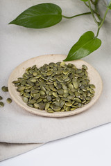 Pumpkin seeds closeup in a plate