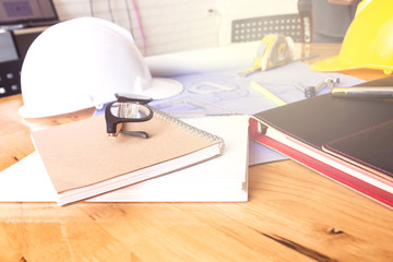 Image of engineer meeting for architectural project. working with partner and engineering tools on workplace vintage tone.