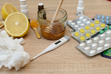 Various remedies for cold on a wooden background