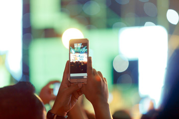 Take photo crowd in front of concert stage