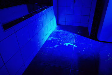 Cleaned place of crime under UV light source