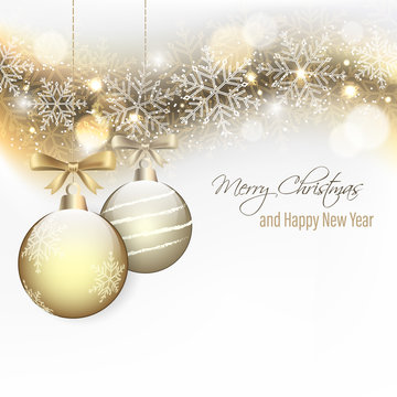 Christmas and New Year wishes with hanging baubles and bow.