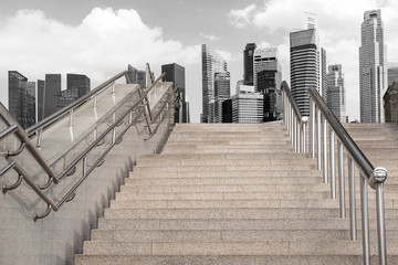 Obraz premium Marble staircase railing stainless steel with the skyscrapers background.