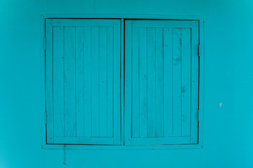 Naklejka na ściany i meble blue window on blue wall with closed. space for text - Vintage wood plank, window background 