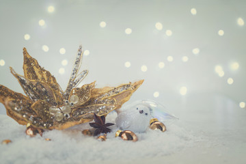 White christmas with snow - white bird and golden flower in snow, retro toned