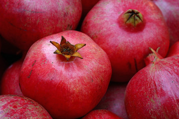 Fresh red ripe pomegranates close up