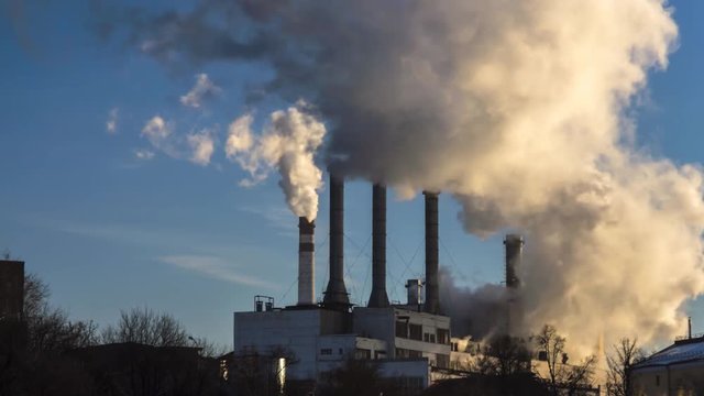 power plant emitting smoke and vapor in cold weather, time lapse
