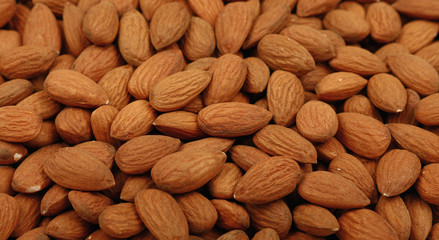 Raw whole almond nuts close up