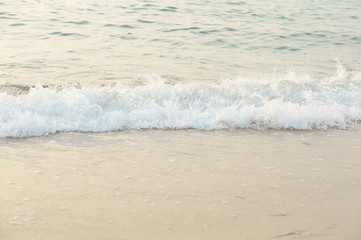 Wave of the sea on the sand beach