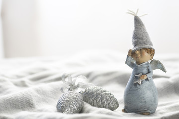 little light blue gnome on wool shawl 