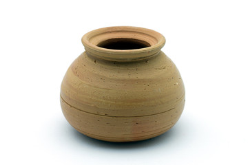 Close-up of soft clay pot over white background