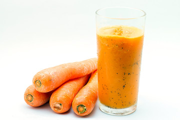 Carrot juice and passion fruit smoothie isolated on white