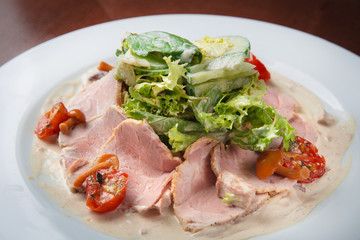 Boiled eggs with smoked ham and vegetables