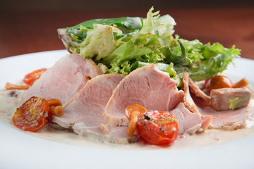 Boiled eggs with smoked ham and vegetables