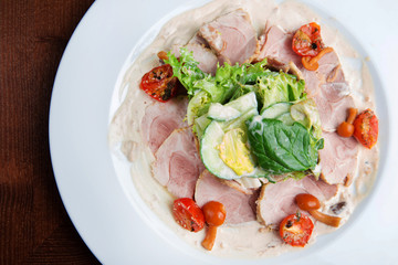 Boiled eggs with smoked ham and vegetables