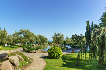 Pond and walkway in the Park of Paradise. Partenit, Crimea , Russia