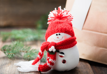 Snowman on wooden table. Christmas decoration. Copy space.