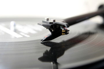 Fototapeta na wymiar Modern high quality turntable record player playing a vinyl analogue music LP