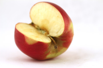 Fototapeta na wymiar Cut apple isolated on white background