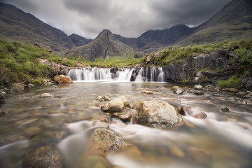Fototapeta na wymiar Waterfall in Fairy Pools rocky stream on Isle of Skye