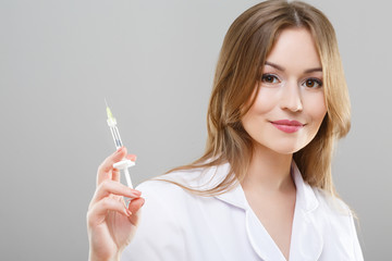 Obraz premium Beautiful nurse in white medical robe