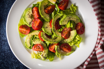 Avocado salad with cherry tomatoes and chia seeds