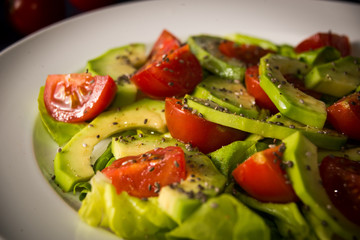 Avocado salad with cherry tomatoes and chia seeds