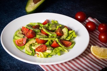 Avocado salad with cherry tomatoes and chia seeds